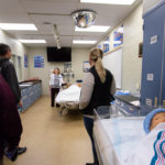 The college’s modern nursing labs, complete with high-tech “patients” of varying ages, are shown off by Valerie A. Myers, assistant dean of nursing.