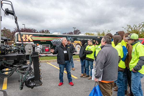 Industry vendors brave the blustery conditions, including Mike Spolar, representing Midland Asphalt Materials Inc.
