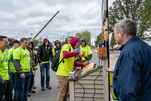 Daniel E. Durden (right), CEO of the Pennsylvania Builders Association, watches the hotly contested screw gun competition.
