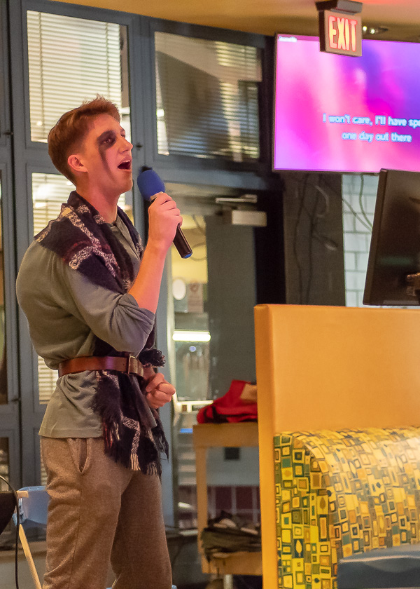 The Disney theme continues with a costumed Quasimodo singing 