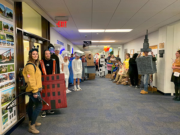 Costumed students assemble for a parade through the Hager Lifelong Education Center's architecture wing.