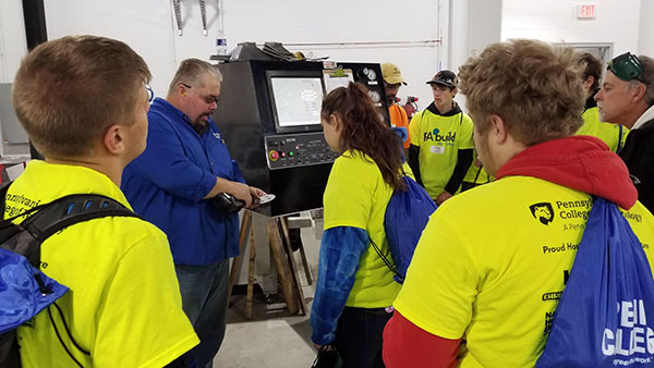 Guests also got a tour of the expanded welding labs, where instructor Jacob B. Holland demonstrates a ProStar precision cutting table.