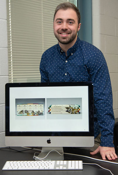 Brandon M. Wolff poses with his award-winning “Trailblaze Chocolate Co. Packaging” designs. Wolff, a 2019 graphic design graduate from Pennsylvania College of Technology, won a National Gold Award from the American Advertising Federation.