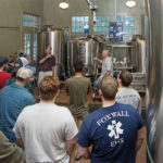 Yarrington talks with students during a brewery visit.