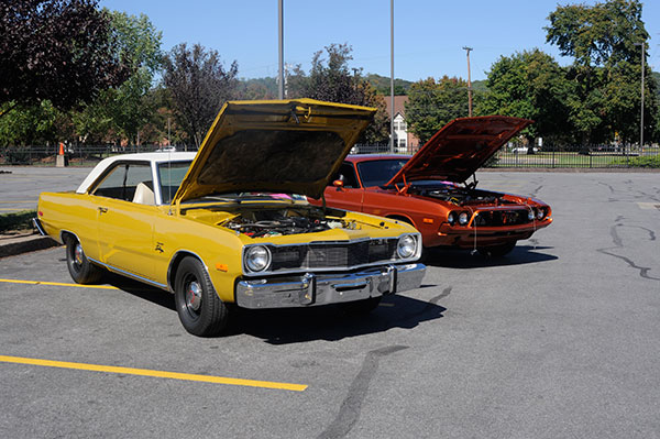 Classic Dodges – a 1975 Dart Swinger owned by Christopher J. Holley, an assistant professor of automotive, and a 1973 Challenger owned by Don Flook – await their audience.