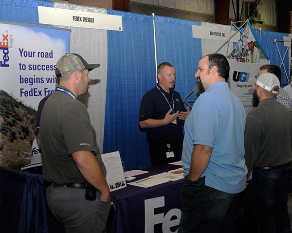 Helping to handle the crowd at the FedEx Freight booth is Dustin Schmerge, district fleet maintenance manager. FedEx has been a phenomenal supporter of the college, hiring a number of graduates and making substantial equipment donations – from retired aircraft to multiple over-the-road vehicles.