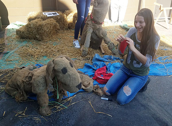 Marilyn T. Hiller, a landscape/horticulture technology: plant production emphasis major from South Williamsport, puts the final touches on her pet project.