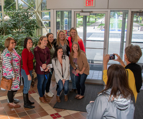 Before touring the Dental Hygiene Clinic, alumni gather for a photo, taken by Mary Jo Saxe, associate professor of dental hygiene, to be sent to longtime Dental Hygiene Clinic dentist Dr. Tom Klena, who recently retired.