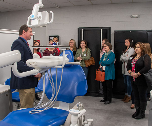 Dental hygiene progam director Shawn A. Kiser shows off the features of student workstations, upgraded during a renovation of the Dental Hygiene Clinic in 2016.
