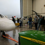 Aviation maintenance technology students gather around Dressler’s Cessna Citation I.