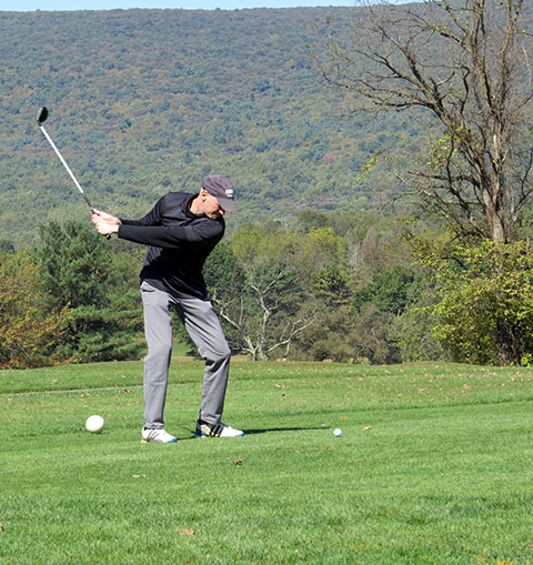 Ken W. Engel, the college's coordinator of digital publishing, exhibits additional skills at the tee.