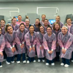 Aptly attired, dental hygiene students and faculty paint the clinic pink.