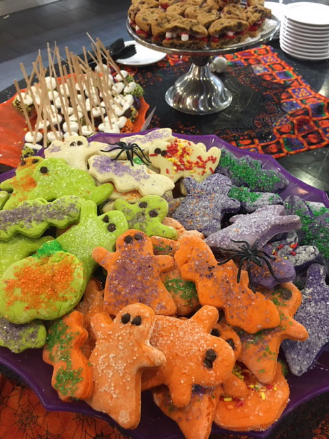 Ghost cookies deliciously gallop off the plate.