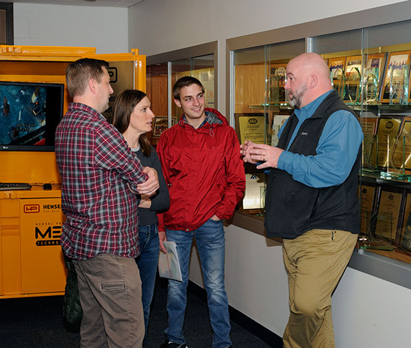 Wayne R. Sheppard (right), assistant professor and department head for construction management, champions the program. Faculty and student members of the Construction Management Association handled additional visitors in the hallway and adjacent classrooms.