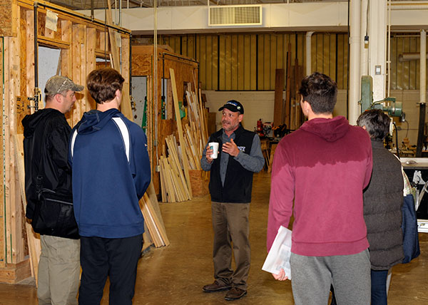 Instructor Barney A. Kahn IV leads a tour of construction labs.