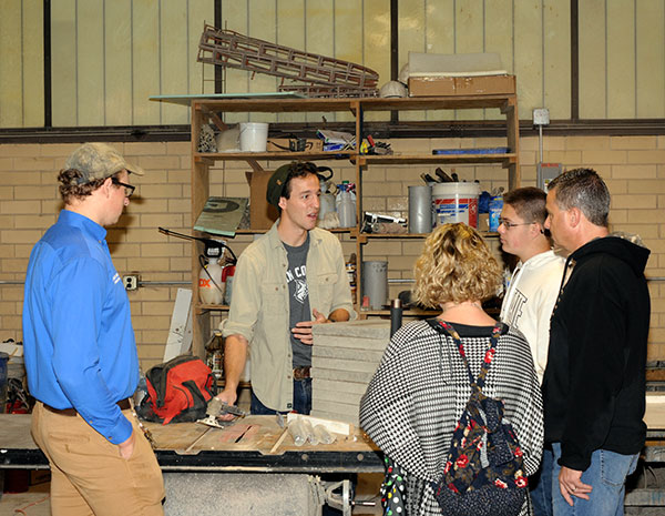 Visitors to the concrete science lab are enlightened by knowledgeable students Tyler M. Troup (left) and Joseph F. DiBucci.