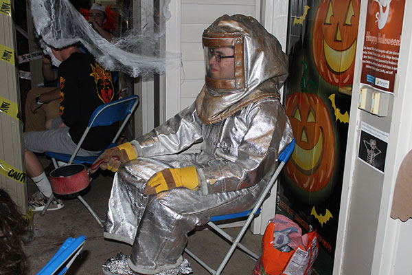A Village resident adds a touch of hazmat to the candy-laden welcome mat outside his apartment.