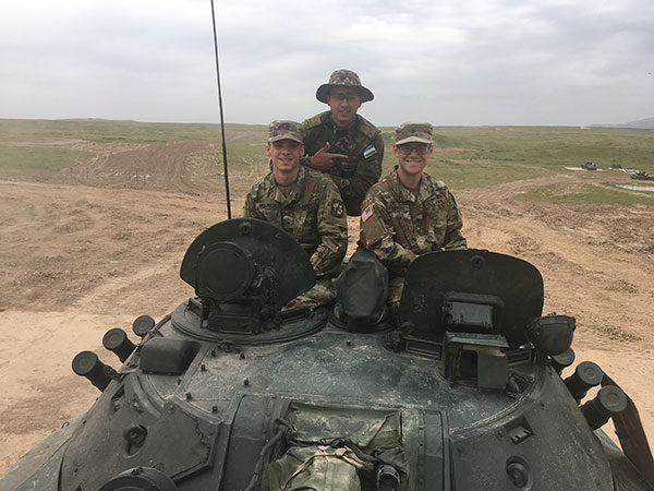 Weinrich (front left) experiences a T-64 Soviet main battle tank during his 21-day stay in Uzbekistan. Weinrich was in the former Soviet republic as part of the Cadet Coalition Warfighter Program. To the right of Weinrich is a cadet from the University of Mississippi. Behind them is a Uzbek cadet training to become an infantry officer. 