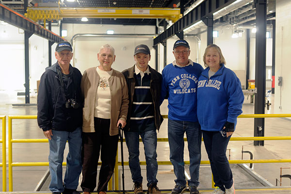 Before traveling to UPMC Field for his Pep Band gig at Saturday's soccer doubleheader, Peter H. Gregory (center), a welding and fabrication engineering technology major from Gambrills, Md., provides parents and grandparents with a tour of his expanded lab.