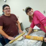 Hunter F. Williams, of Drums, and Petrison roll out dumpling dough. Williams holds an associate degree in on-site power generation (2018) and is pursuing a bachelor’s in applied management.