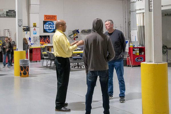 Automotive instructor Eric D. Pruden (left), stationed at the collision repair paint lab.