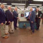 The group pauses in front of a ProtoTrak lathe, among equipment purchased with a National Science Foundation grant to combat the skills gap in advanced manufacturing. From left are Owlett, Wheeland, Turzai, Yaw and Borowicz.