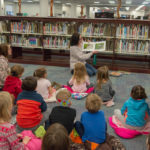 Warner shares the sandhill cranes' story with CLC youngsters in Madigan Library.