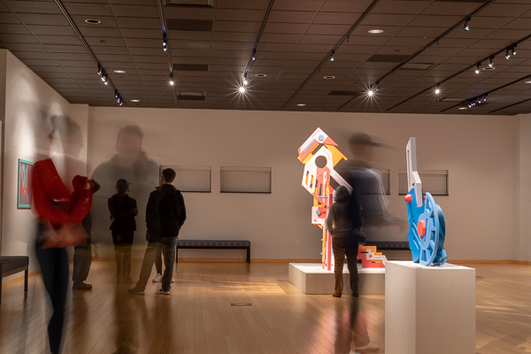 The blur of patrons moving among Repko's imaginative pieces marks a Nov. 7 gallery reception.