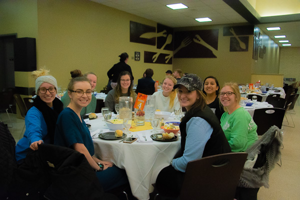 Dental hygiene students gather in KDR for the family-style meal.