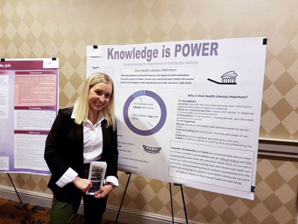 Penn College dental hygiene student Jordyn Kahler, of York, with her sixth-place informational poster, titled “Knowledge is Power: Oral Health Literacy.” Kahler presented the topic at the conference