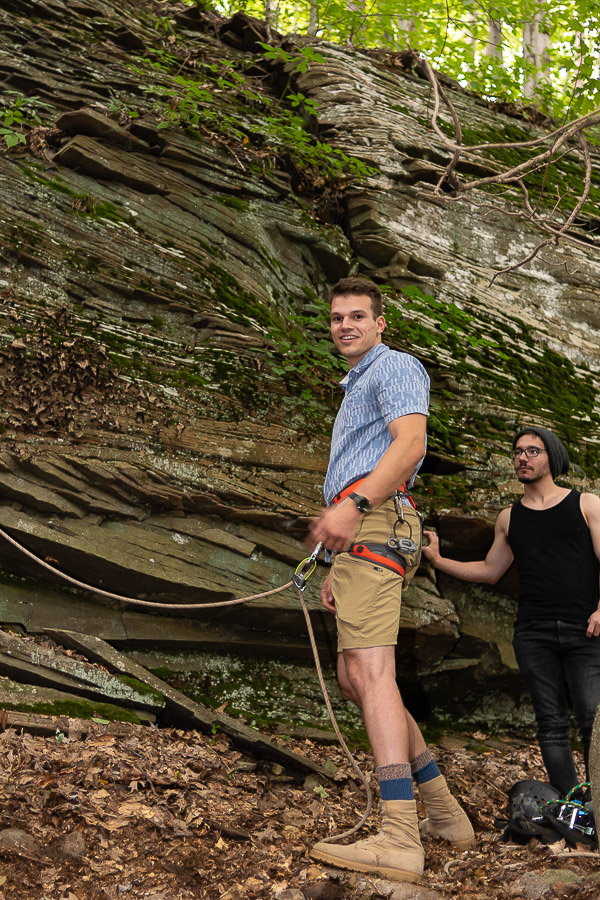 Harnessed up, Kyle P. Amon, an engineering design technology student from Lafayette Hill, prepares to climb the cliff. 