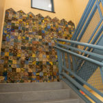 Artwork awaits stair strollers.