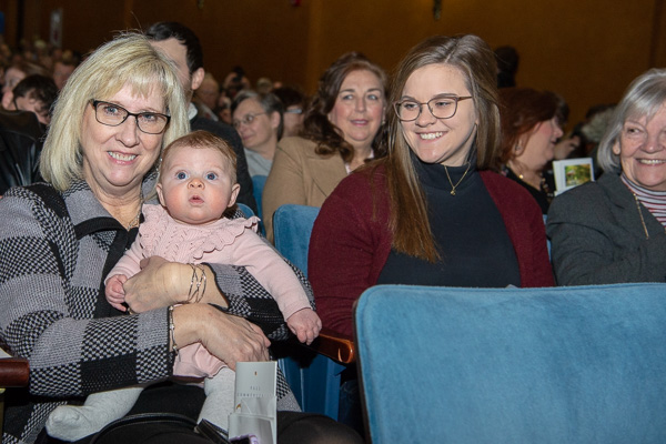 Robin A. Rader-Edkin, a Penn College Dining Services worker, with granddaughter Kennedy, the daughter of President’s Award Winner Nathan A. Rader-Edkin and Bailey Frey (at center), ’19, baking and pastry arts