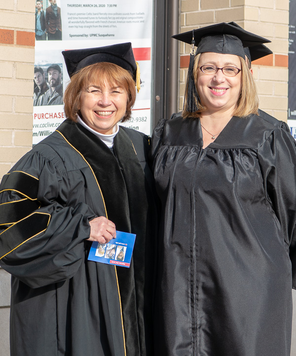 Carol A. Lugg (left), dean of construction and design technologies, with another successful graduate: Christy S. Phillips, applied technology studies