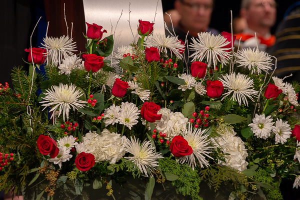 Holiday-inspired podium flowers enhance an already joyful day.