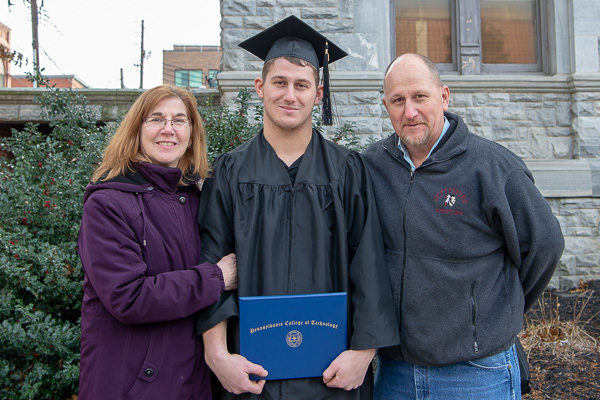 Jake W. Sharrah, a 2018 diesel technology alumnus, joins his parents in celebrating his applied management degree ...