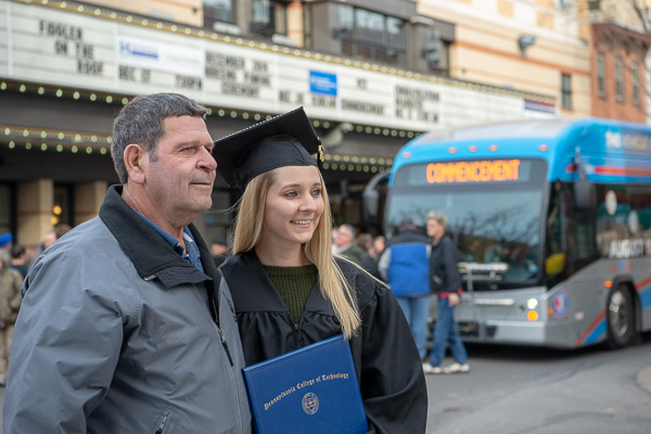 Making a sparkling memory, Caitlin A. Dauberman shares a special moment with her grandfather. Dauberman tacked a bachelor's in applied health studies: radiography concentration to her August associate degree in radiography.