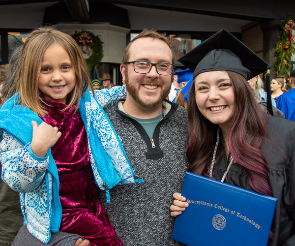 Rynearson, of Washington, with husband, Tom (a 2016 residential construction technology and management grad), and daughter Jade (who was also celebrating a lost tooth!)