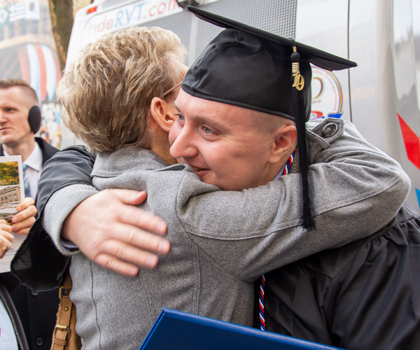 Benjamin H. Eischeid, an accounting graduate from Williamsport, receives loving congratulations from his family.