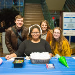 With piping bags full of icing, Wildcat Events Board students eagerly staff the cookie-decorating table. From left are David Eaton, of Harrisburg; Shaqira S. Drummond, of Williamsport; Madison N. Bower, of Muncy; and McKenna N. Myers, of Northumberland.