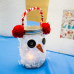 Snowman luminaria fashioned from glass jars add a festive touch.