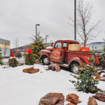 A pre-winter snowfall enhances the decorated Dodge truck outside College Avenue Labs.