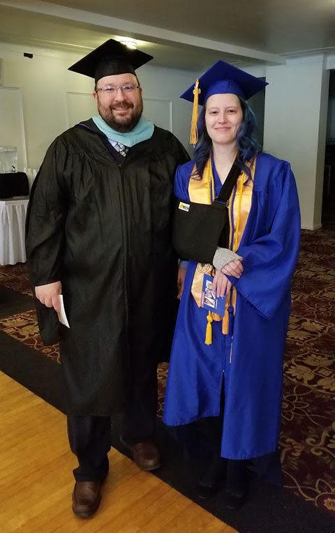 Justin W. Beishline, assistant dean of transportation and natural resources technologies, connects with Celeste G. Moquin, of Port Matilda, who graduated in on-site power generation and received the Pathfinders to Excellence Award.
