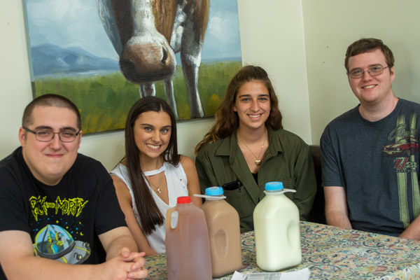 Students in the Food Sustainability class prepare to taste sustainably produced apple pear cider and milk at Milky Way Farms in Troy. From left: Siegle, Hoffman, Becker and Schreckengost.
