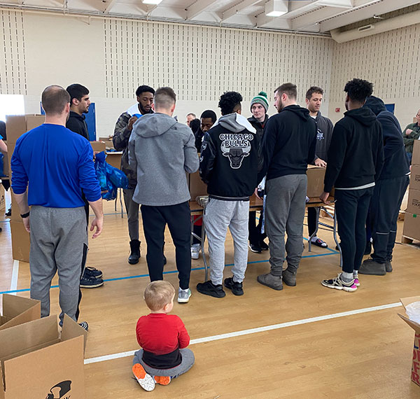 Wildcat athletes were represented throughout the day – including the men's basketball team, joined (in foreground) by coach Geoff B. Hensley and his young son.