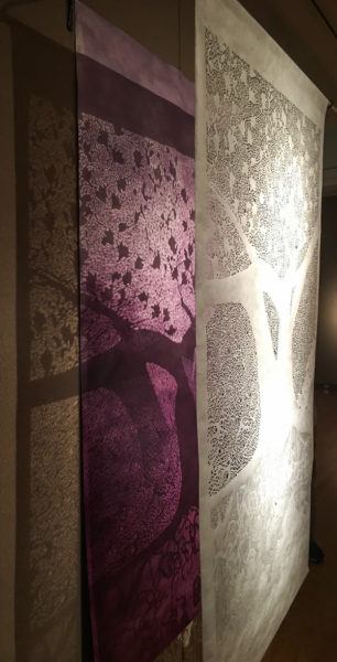 Nguyen's "Barbara - Foreign," 85 inches by 49 inches; hand-cut Tyvek and wooden rod, spray-painted paper