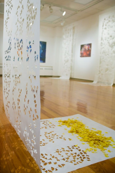 “Ginkgo Message” is a hand-cut fiber panel measuring 144 inches by 33 inches.
