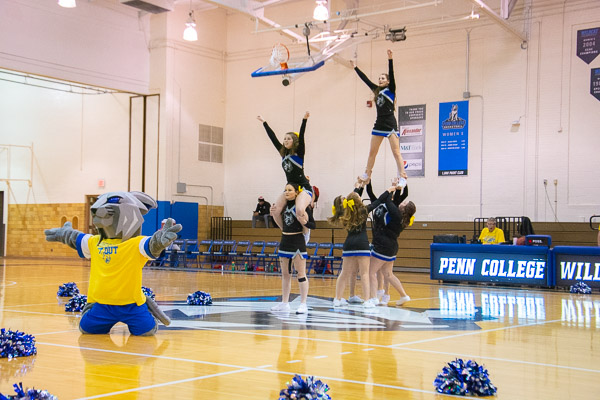 The Penn College cheerleaders (plus one) take to the air.