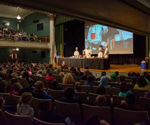 Fifth graders from several school districts pack the ACC Auditorium to learn about Sweet and Savory Science, presented by Suchwala and three student assistants: Christopher M. Bashaw, of Jersey Shore; Rachel J. Gobin, of Carlisle; and Crowl.