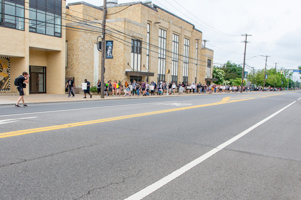 The line, impressively stretching as far as the eye can see down West Third Street, moves eastward through campus.